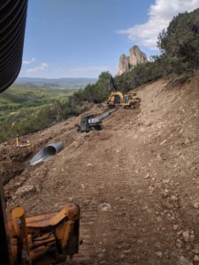 Ditch Repair & Reconstrution with Needle Rock in the Background